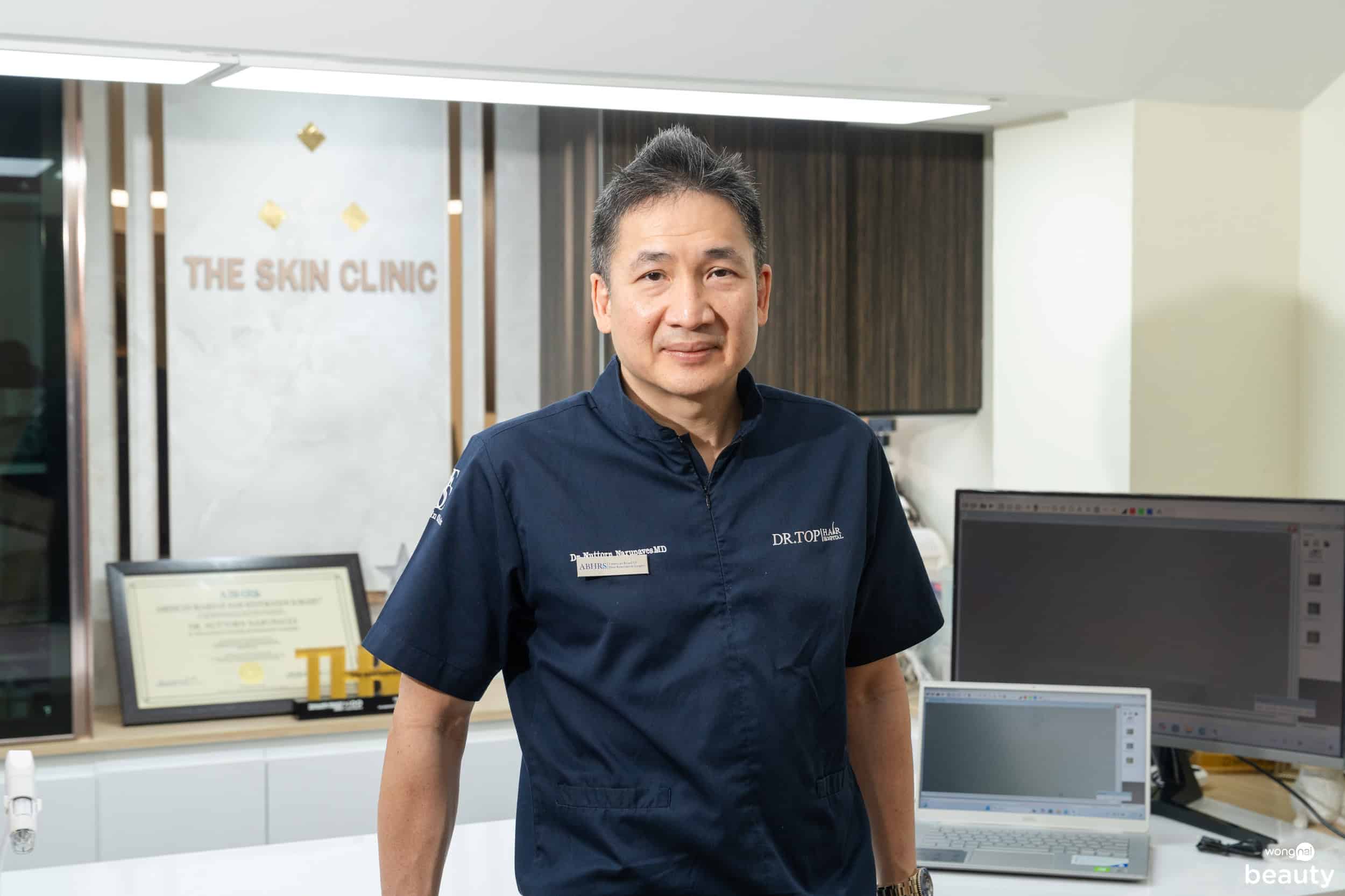 Dr Nuttorn in his office